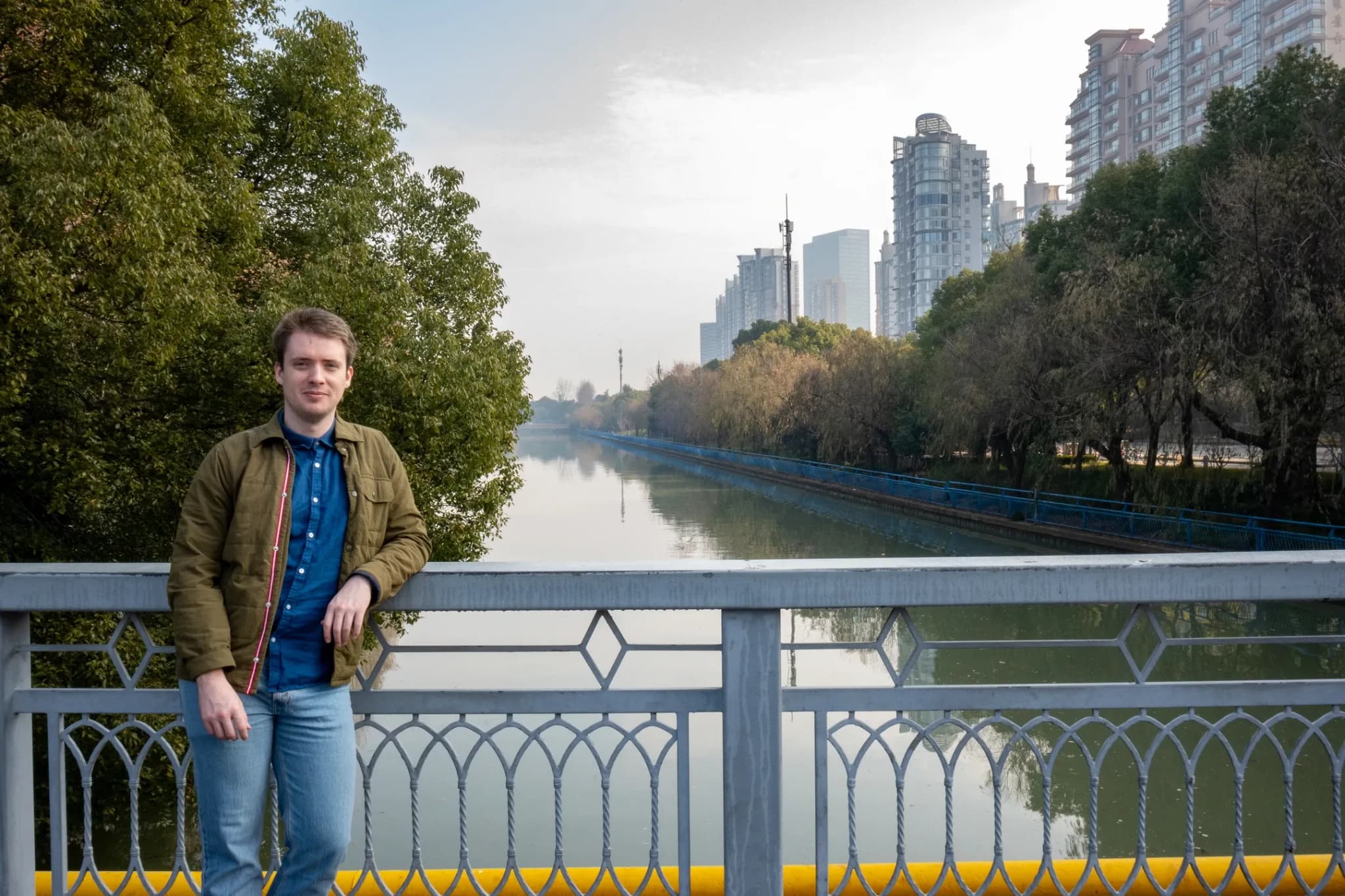 Ash standing by the river in the People's Garden